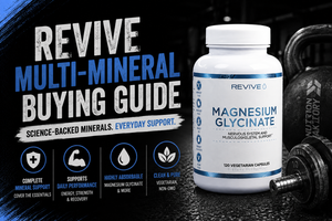 Bottle of Revive Multi Mineral capsules with key macro and trace minerals arranged neatly beside a glass of water.